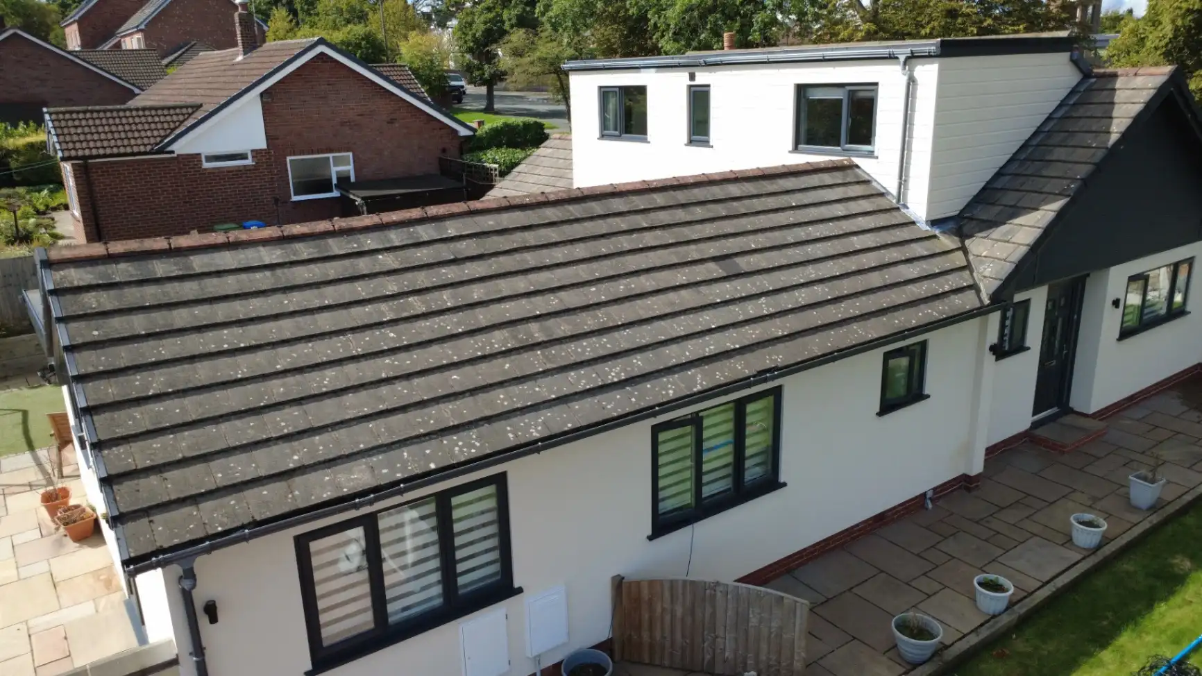 Roof scrape and biocide treatment