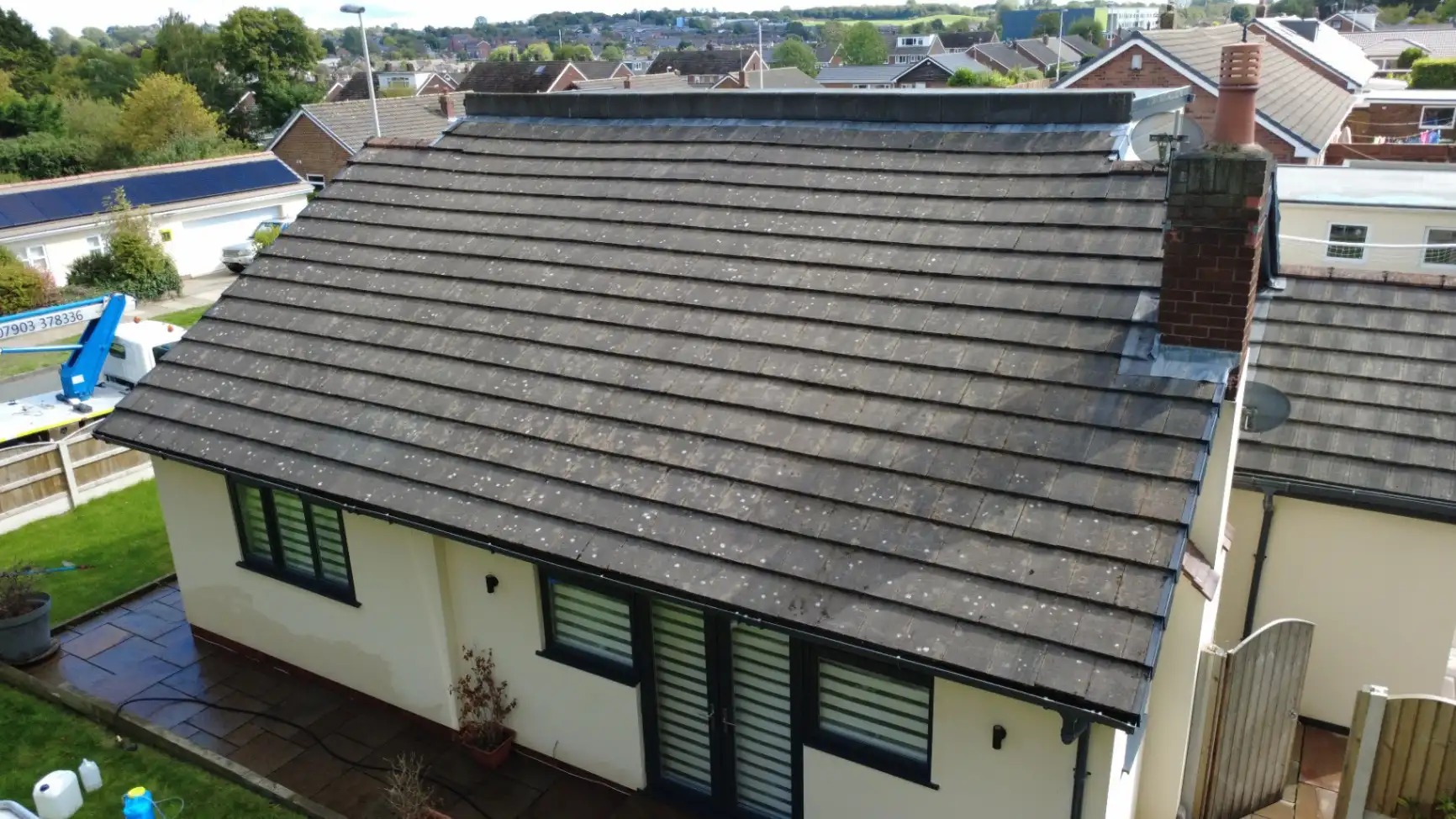 Roof scrape and biocide treatment