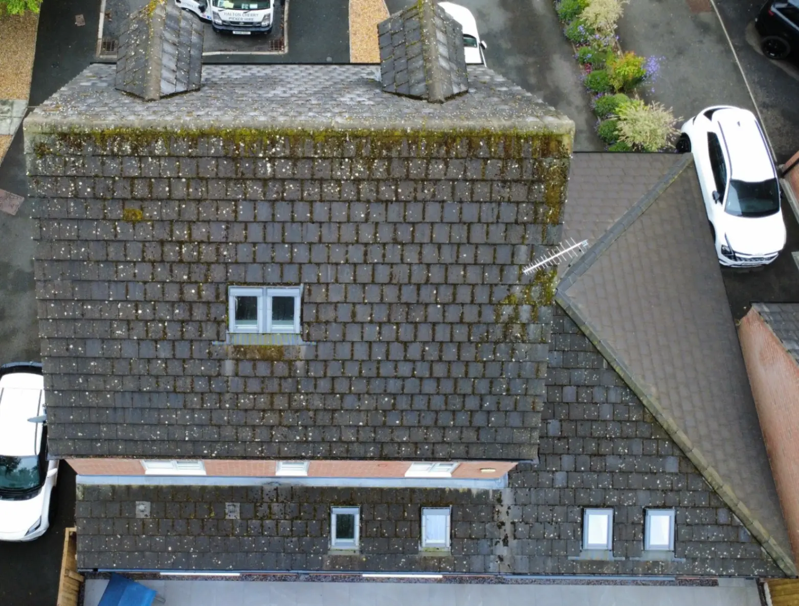 The same Cheshire roof before cleaning, still covered in moss