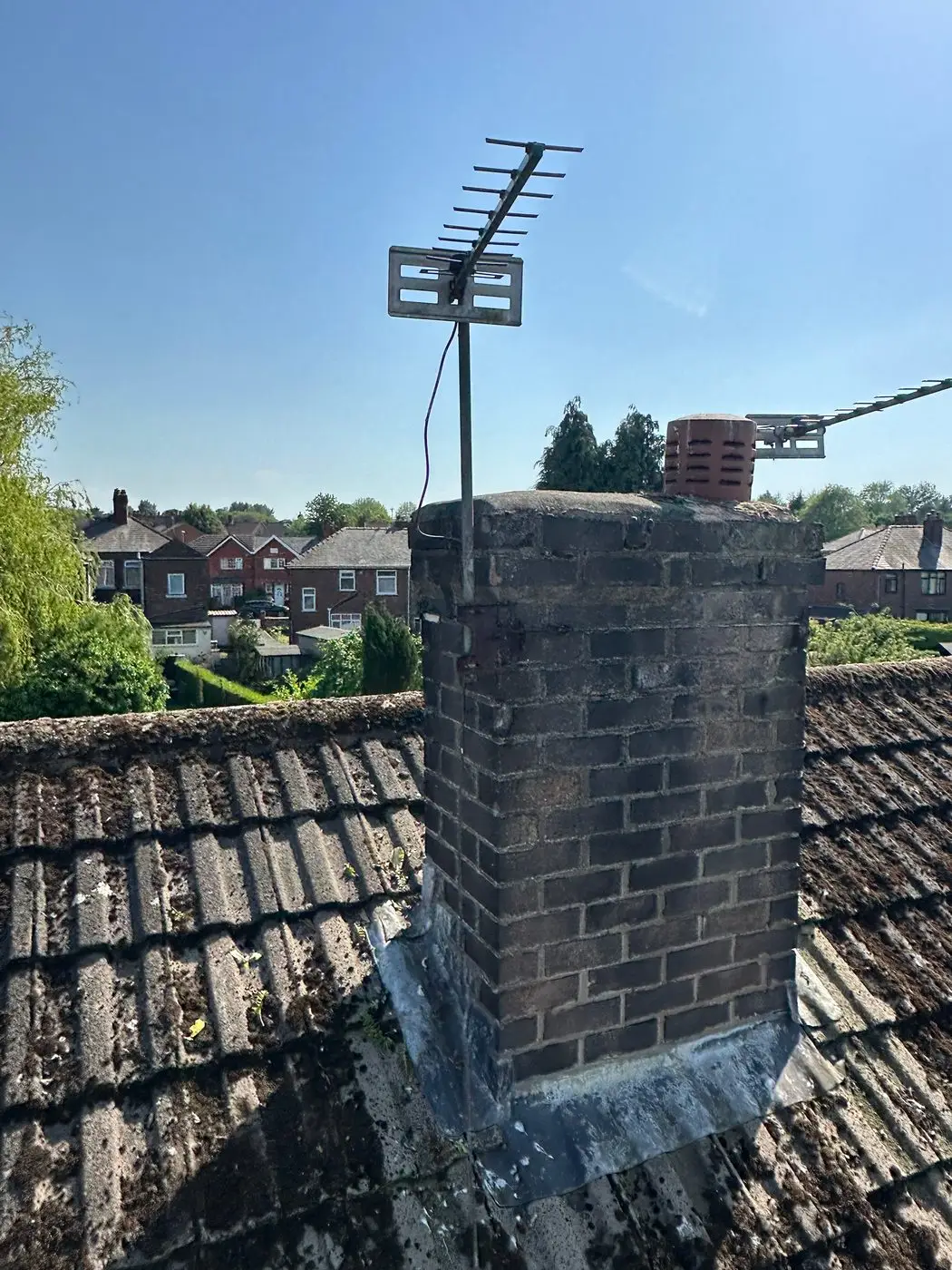 The chimney after the weeds were cleared from the brickwork, reached from a cherry picker