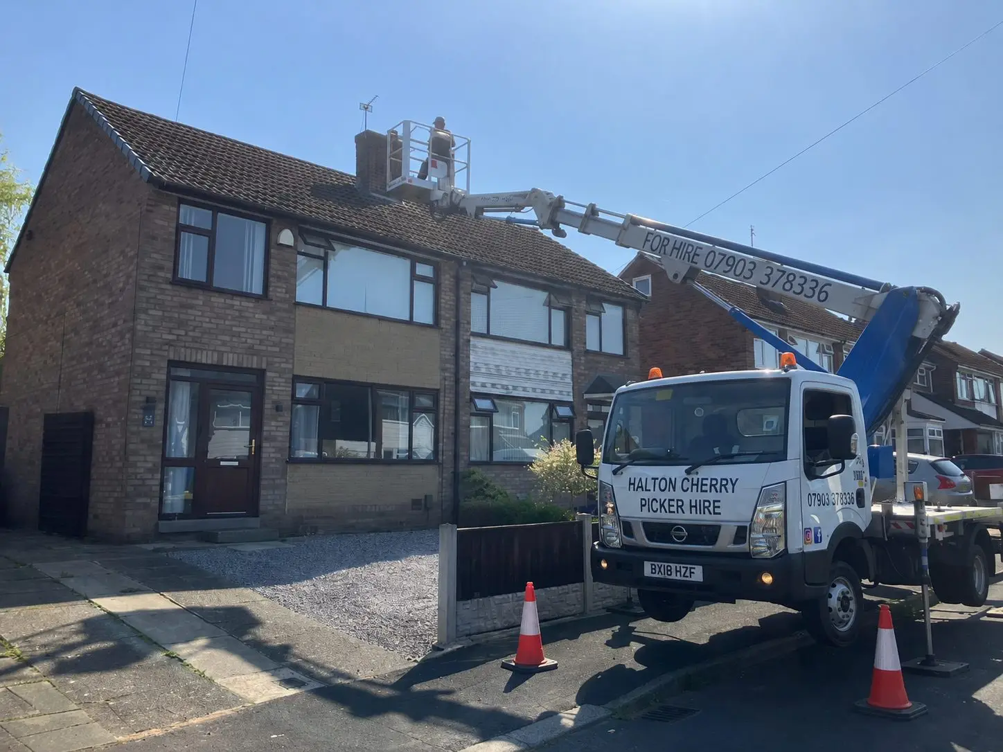 Halton Cherry Picker Hire vehicle with operator working at height