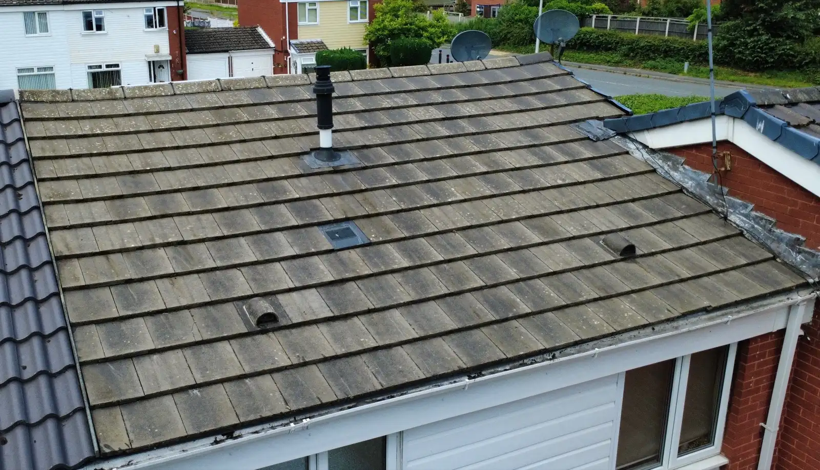 Tiled roof before and after moss removal