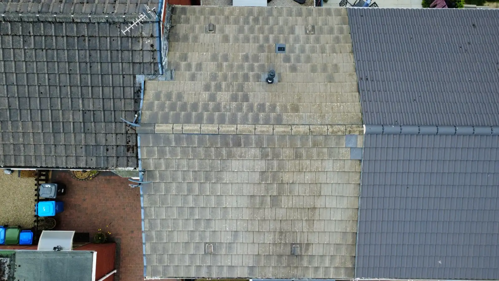 Concrete tile roof before and after moss removal