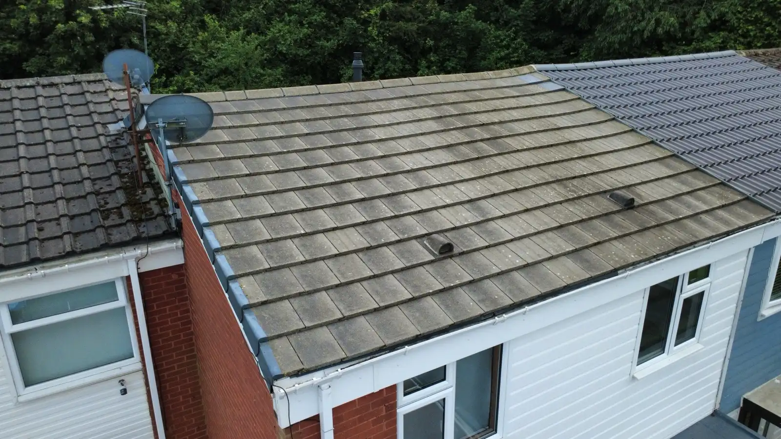 Roof slope before and after a professional clean