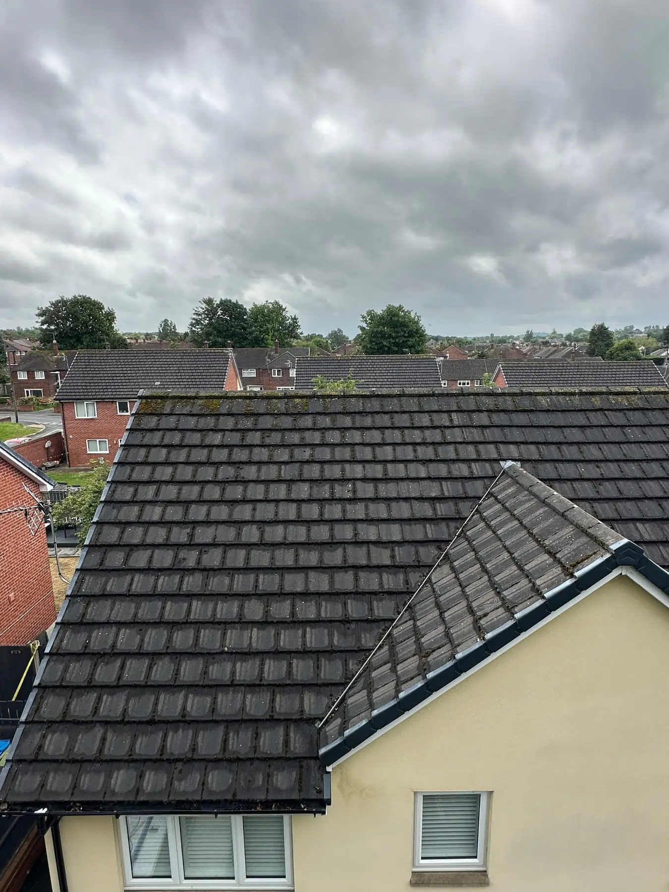 Before: a dirty, weathered tiled roof in need of cleaning