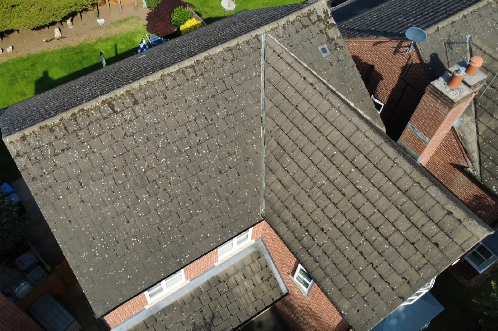 The same Cheshire roof before cleaning, still covered in moss
