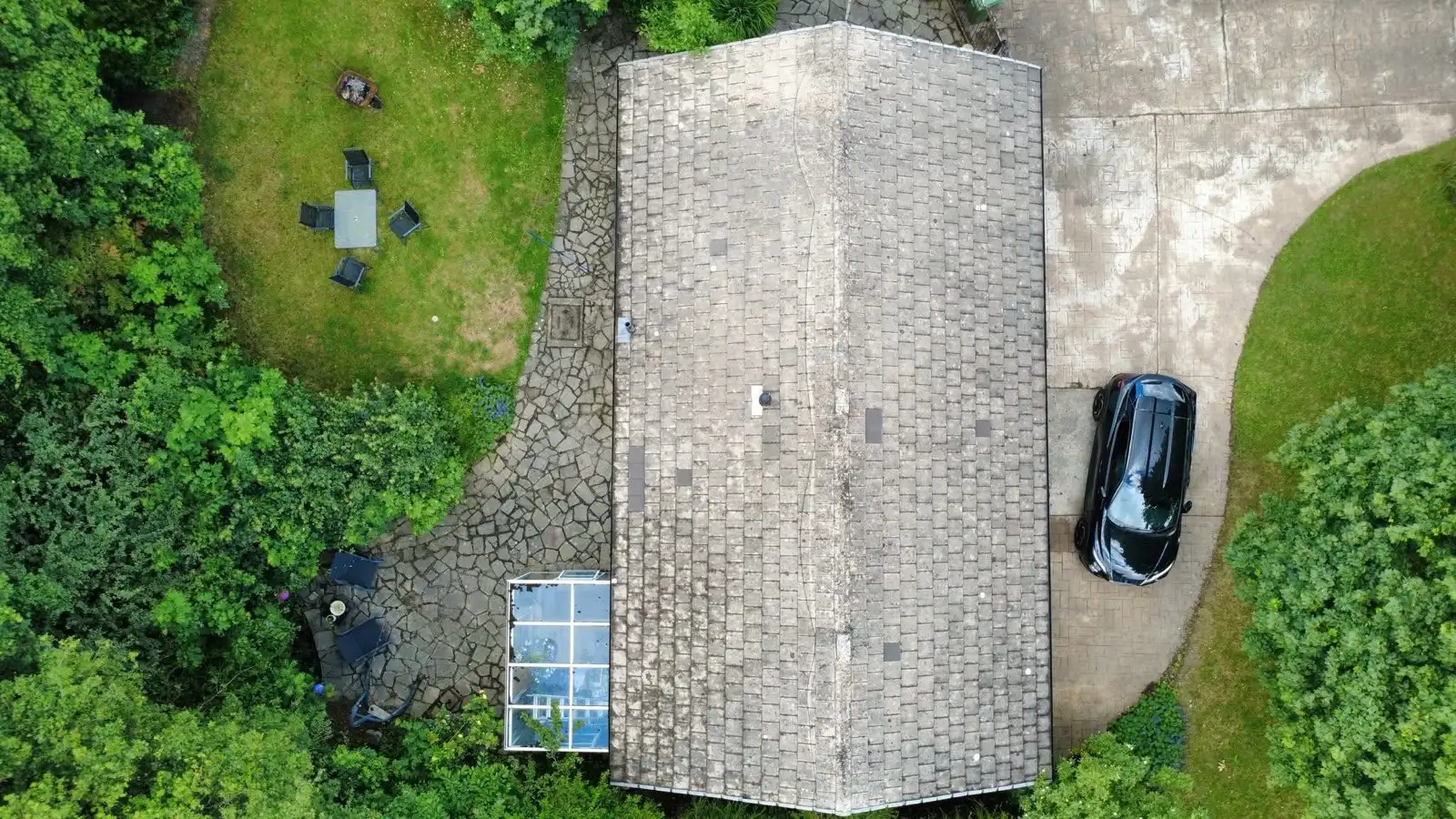 Roof before and after a moss-removal clean