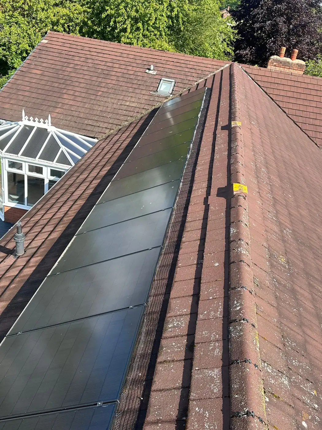 Solar panels on a roof reached from the platform